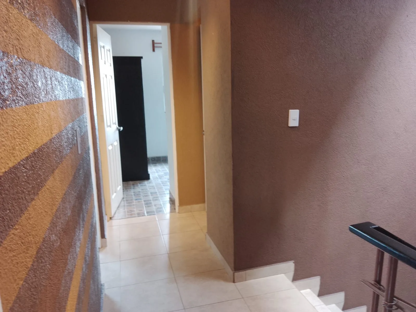Recibidor y arranque de la escalera